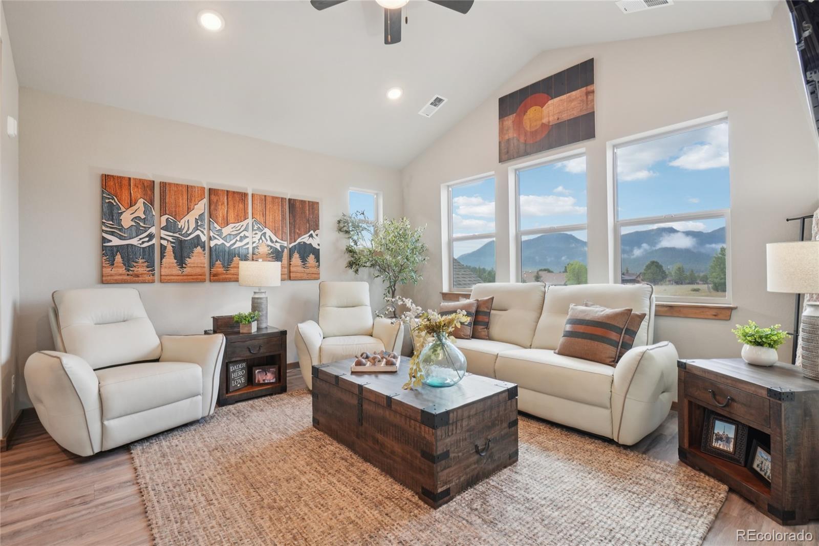 1700 Wildfire Road, Unit 301 Estes Park, CO 80517 - Photo 6 of 38 a living room with furniture and a large window