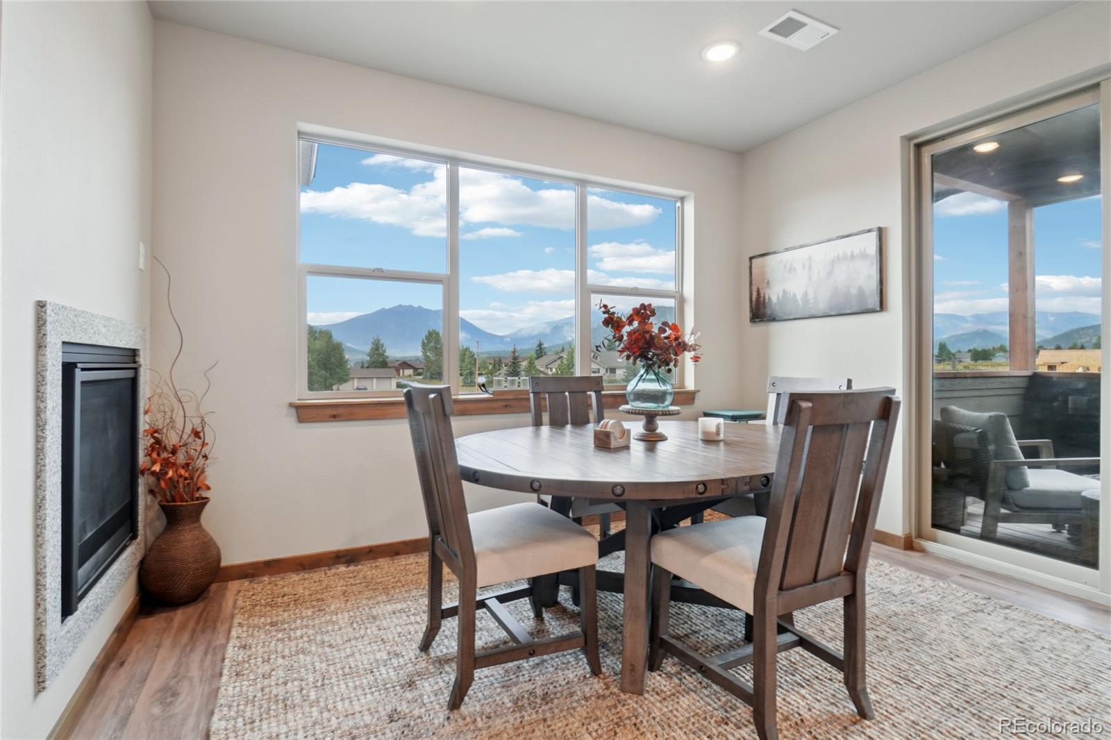 1700 Wildfire Road, Unit 301 Estes Park, CO 80517 - Photo 8 of 38 a view of a dining room with furniture window and wooden floor
