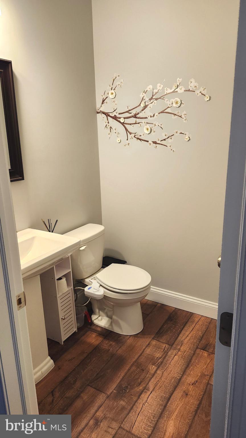 2510 Somerset Road Chambersburg, PA 17202 - Photo 13 of 32 a white toilet sitting next to a bathroom sink