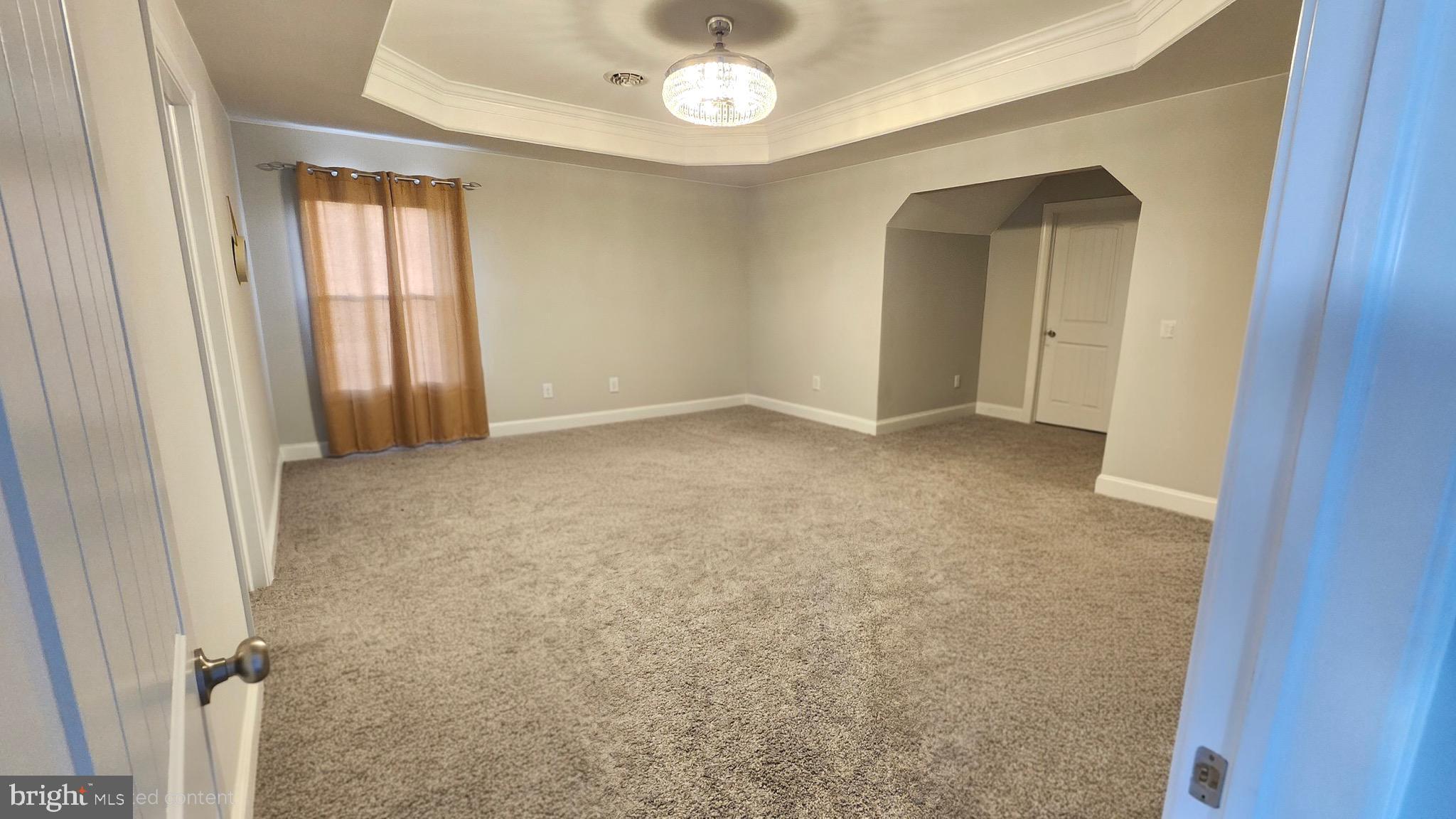 2510 Somerset Road Chambersburg, PA 17202 - Photo 14 of 32 an empty room with a window and hardwood floor