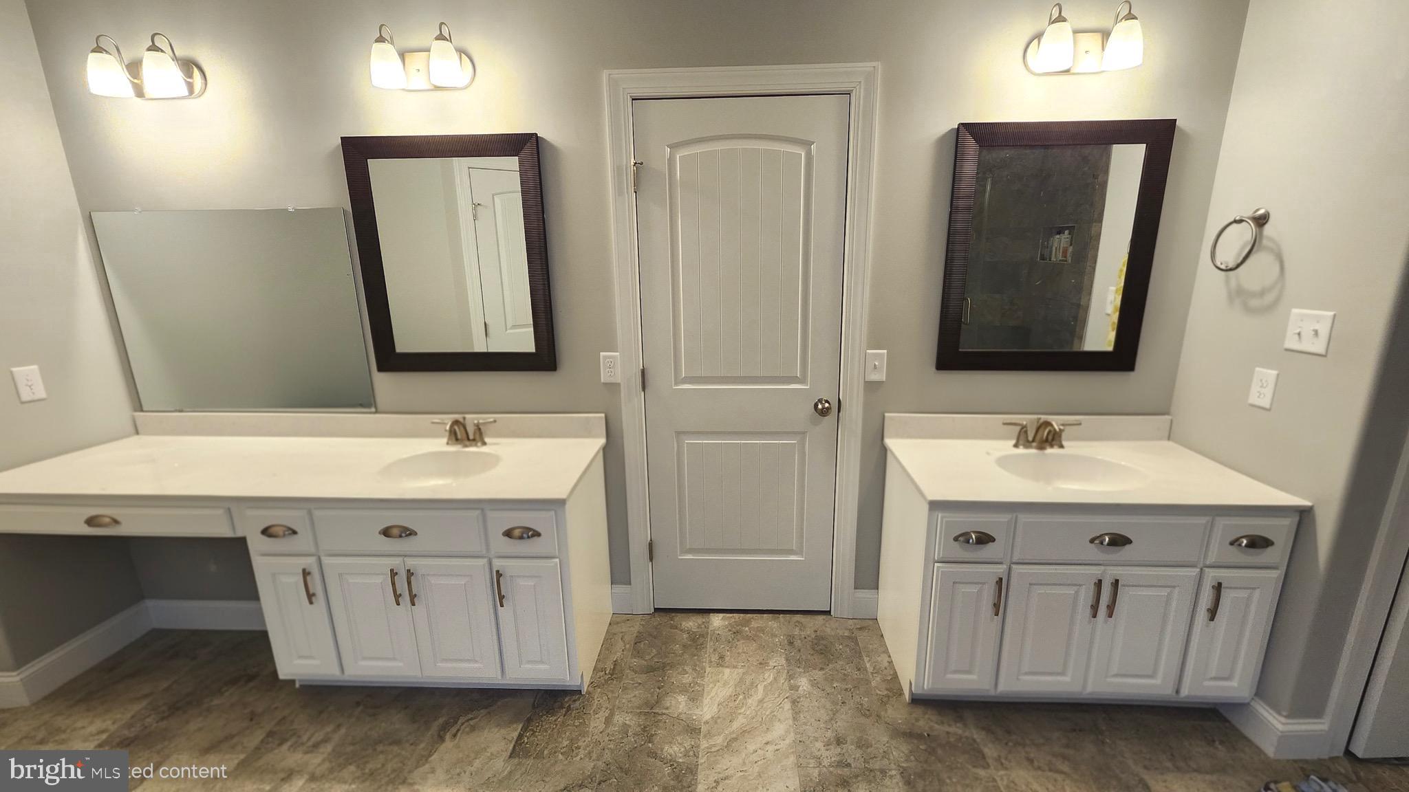 2510 Somerset Road Chambersburg, PA 17202 - Photo 16 of 32 a view of bathroom with a sink a mirror and a vanity