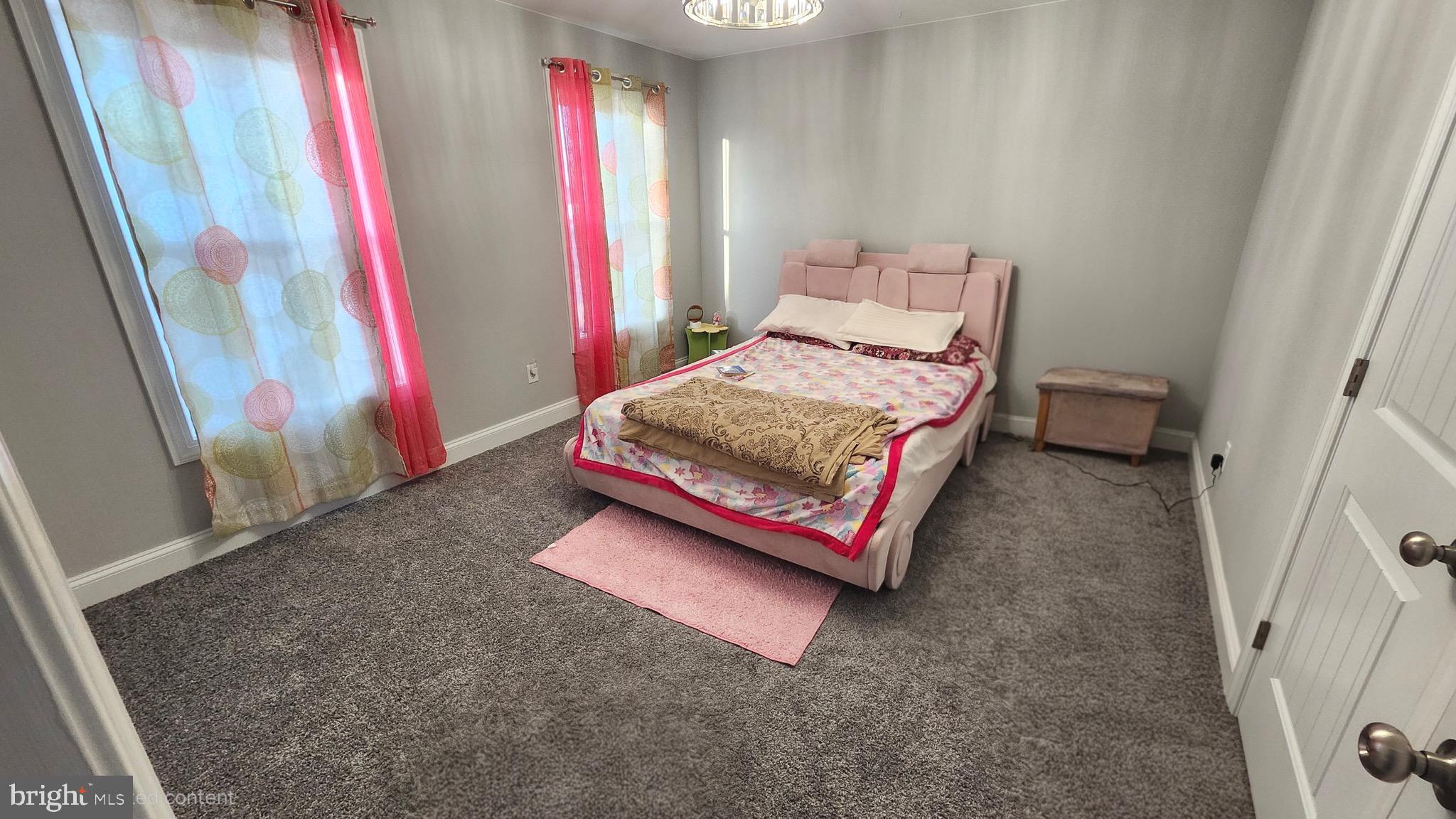 2510 Somerset Road Chambersburg, PA 17202 - Photo 19 of 32 a bedroom with a bed and a mirror