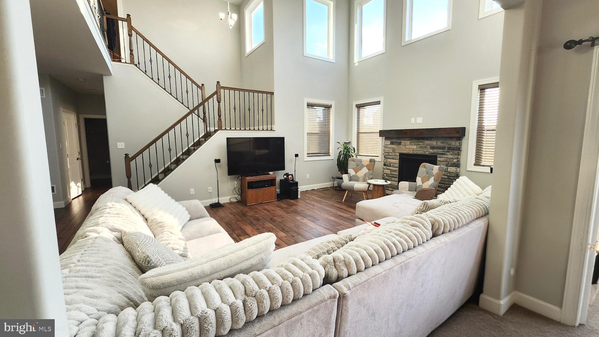 2510 Somerset Road Chambersburg, PA 17202 - Photo 4 of 32 a living room with furniture a fireplace and a flat screen tv