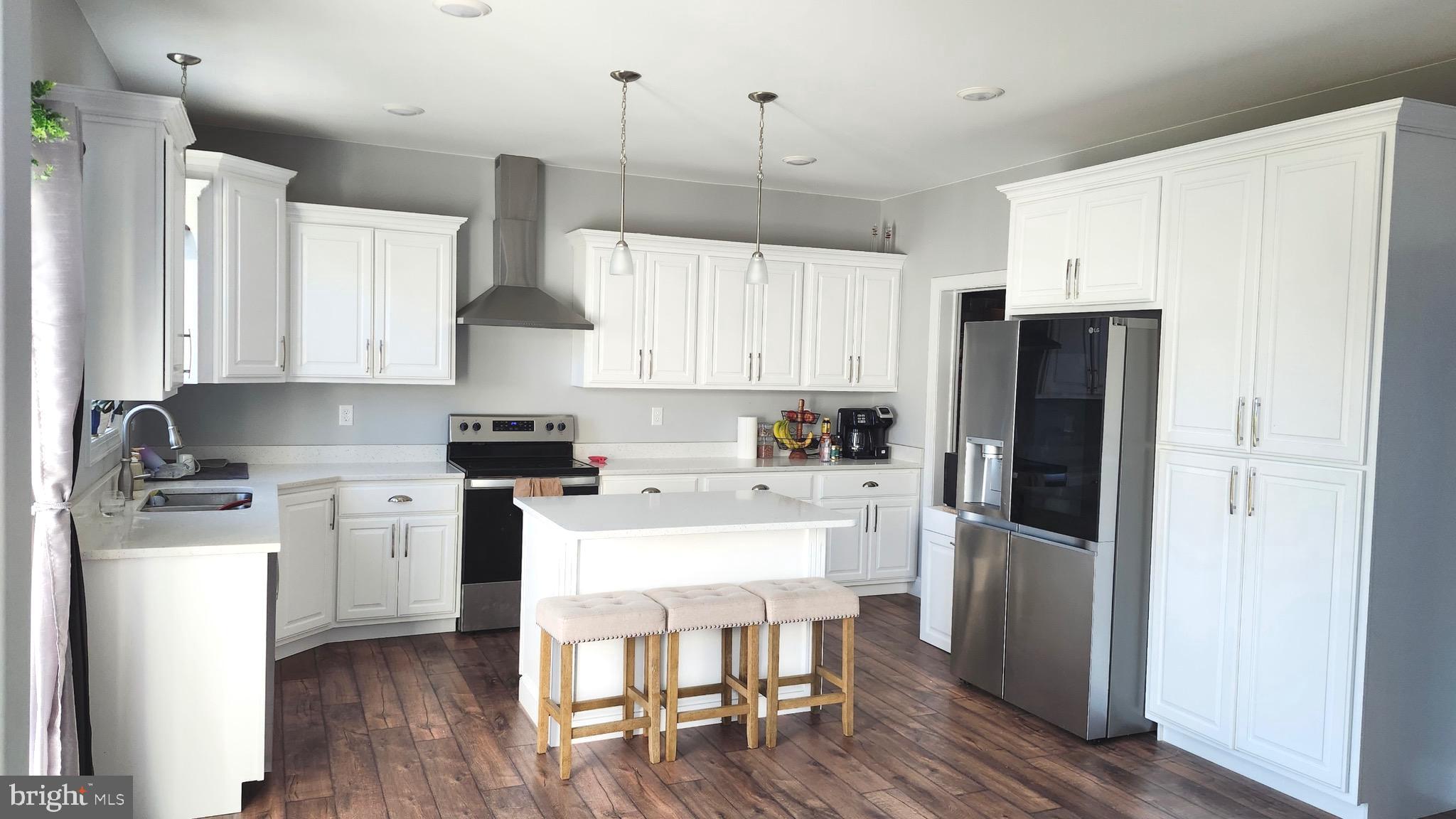 2510 Somerset Road Chambersburg, PA 17202 - Photo 6 of 32 a kitchen with stainless steel appliances a refrigerator a stove a sink dishwasher and a refrigerator with wooden floor