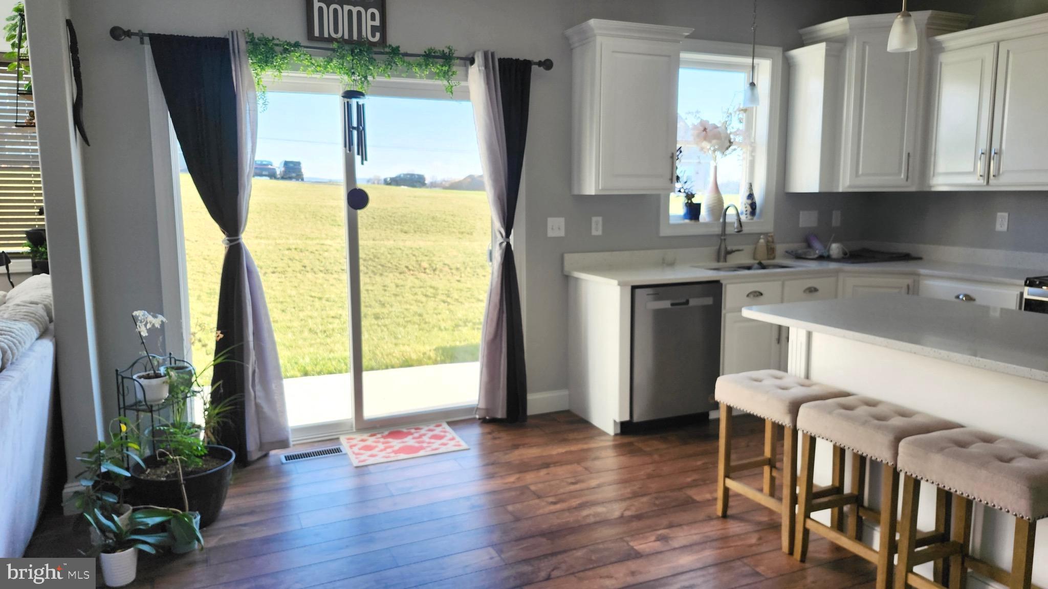 2510 Somerset Road Chambersburg, PA 17202 - Photo 7 of 32 a kitchen with a table chairs and a refrigerator