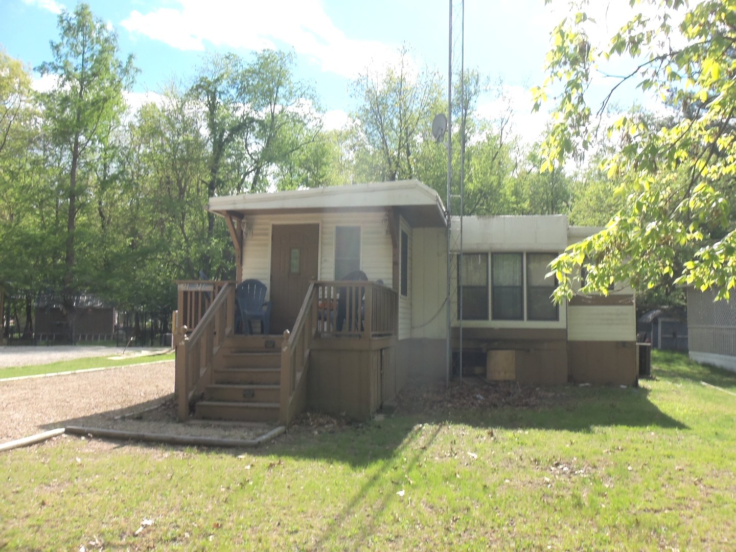 21-216 Woodhaven Sublette, IL 61367 - Photo 1 of 23 a view of a backyard with plants and a fountain