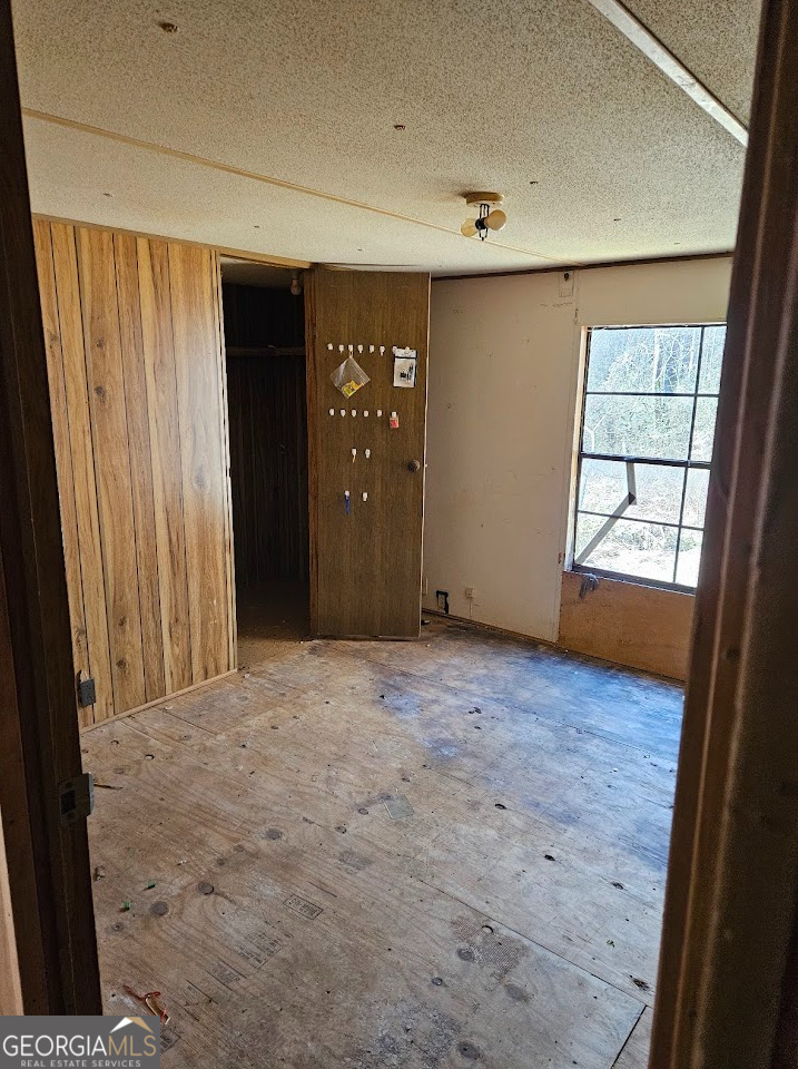 1810 Sandy Flat Road Bowdon, GA 30108 - Photo 19 of 30 en empty room with windows and closet