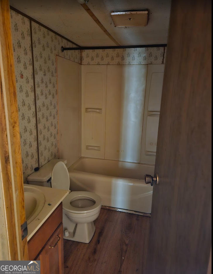 1810 Sandy Flat Road Bowdon, GA 30108 - Photo 20 of 30 a bathroom with a toilet and a shower