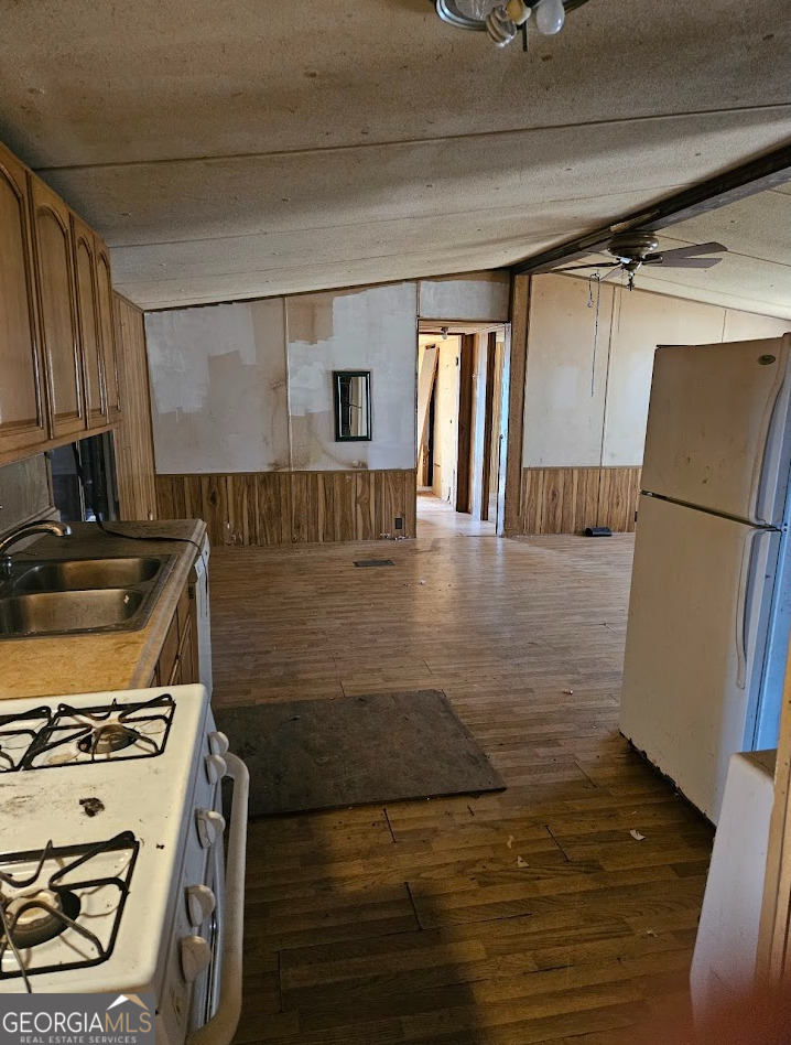 1810 Sandy Flat Road Bowdon, GA 30108 - Photo 30 of 30 a kitchen with granite countertop a sink and a stove top oven
