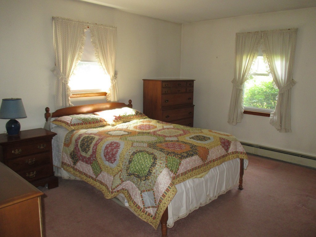 172 Ellis Road Westminster, MA 01473 - Photo 9 of 18 a bedroom with a bed and a dresser next to a window
