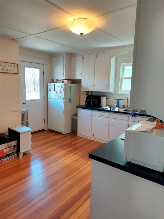 210 High Street Bristol, RI 02809 - Photo 24 of 30 2nd fl. -eat in with access to private balcony style porch-there is an accommodation in rail for for large items to be moved into unit.