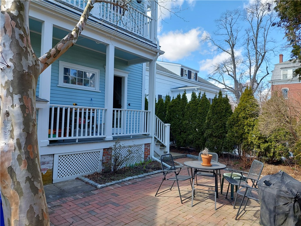 210 High Street Bristol, RI 02809 - Photo 3 of 30 Backyard courtyard style patio with garden perimeter.