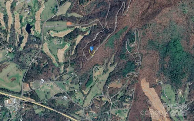 a aerial view of a house with a yard