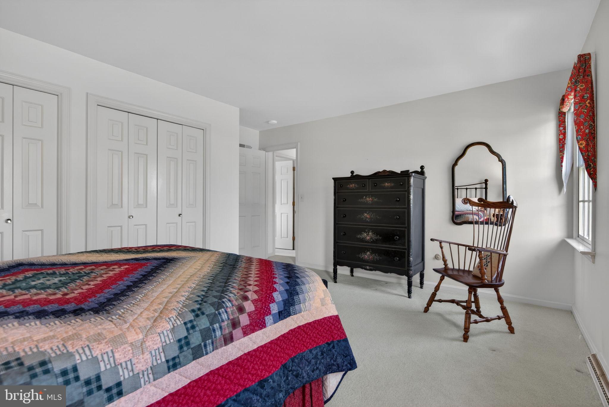 441 Trena Avenue Lancaster, PA 17601 - Photo 38 of 61 a bedroom with a bed a chair and potted plant