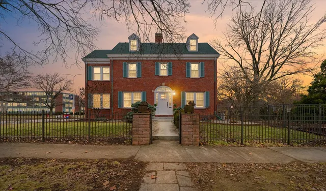 a living room with a fireplace and a fireplace
