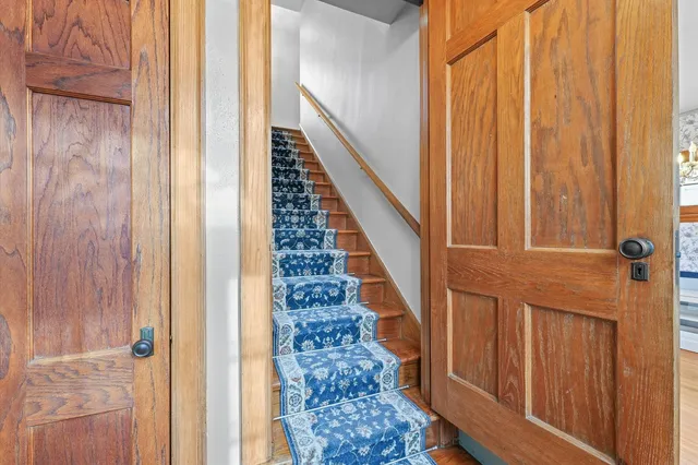 a kitchen with a sink a counter top space stainless steel appliances and cabinets
