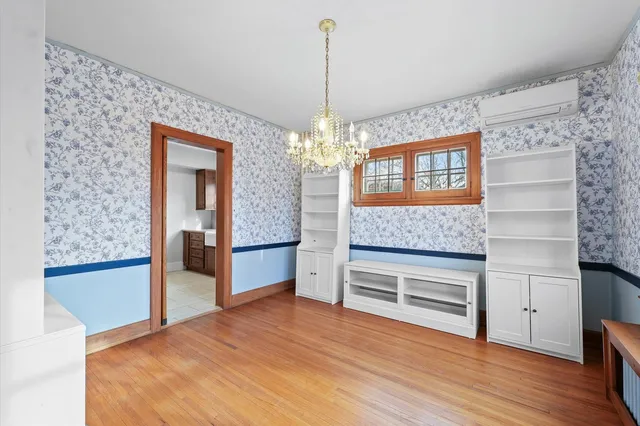 a front view of a house with large windows