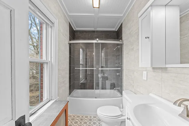 a view of living room with furniture and a window
