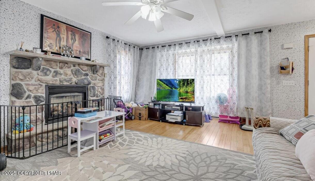 171 Sassafras Road Albrightsville, PA 18210 - Photo 5 of 12 a living room with furniture and a fireplace