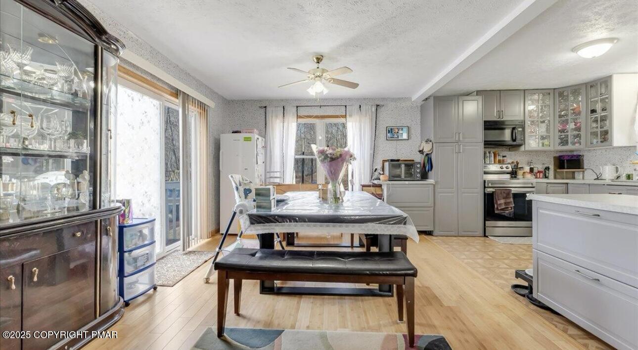 171 Sassafras Road Albrightsville, PA 18210 - Photo 6 of 12 a open kitchen with stainless steel appliances granite countertop a stove refrigerator and cabinets