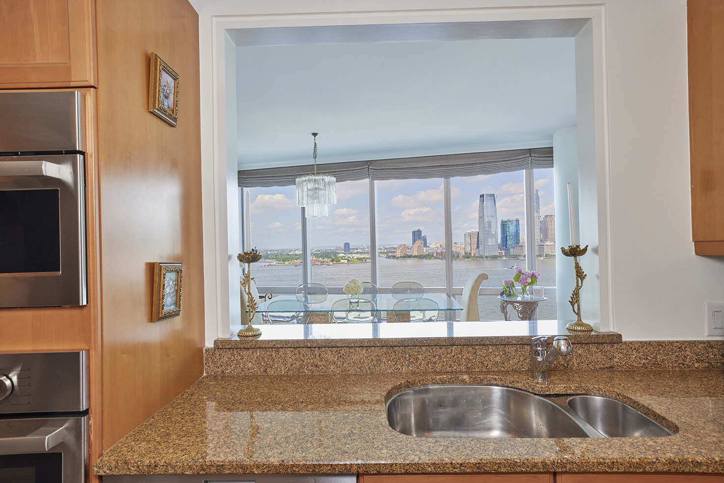 10 West Street, Unit 18A Manhattan, NY 10004 - Photo 5 of 11 a kitchen with a sink and a large window