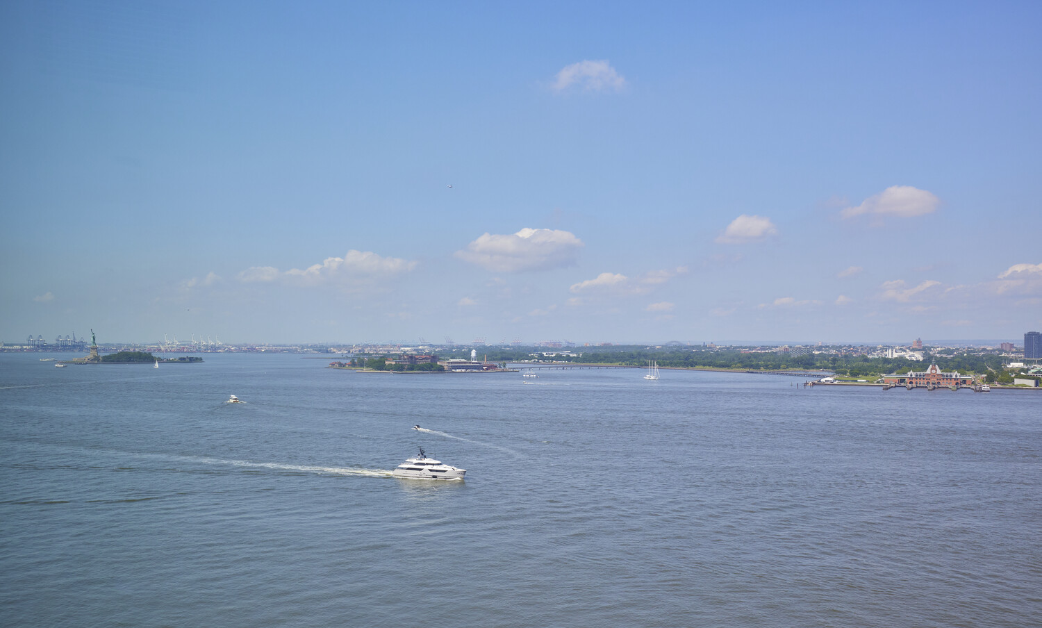 10 West Street, Unit 18A Manhattan, NY 10004 - Photo 9 of 11 a view of an ocean beach and a mountain view