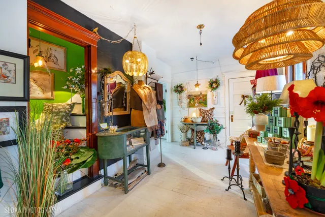 a living room filled with furniture and a chandelier