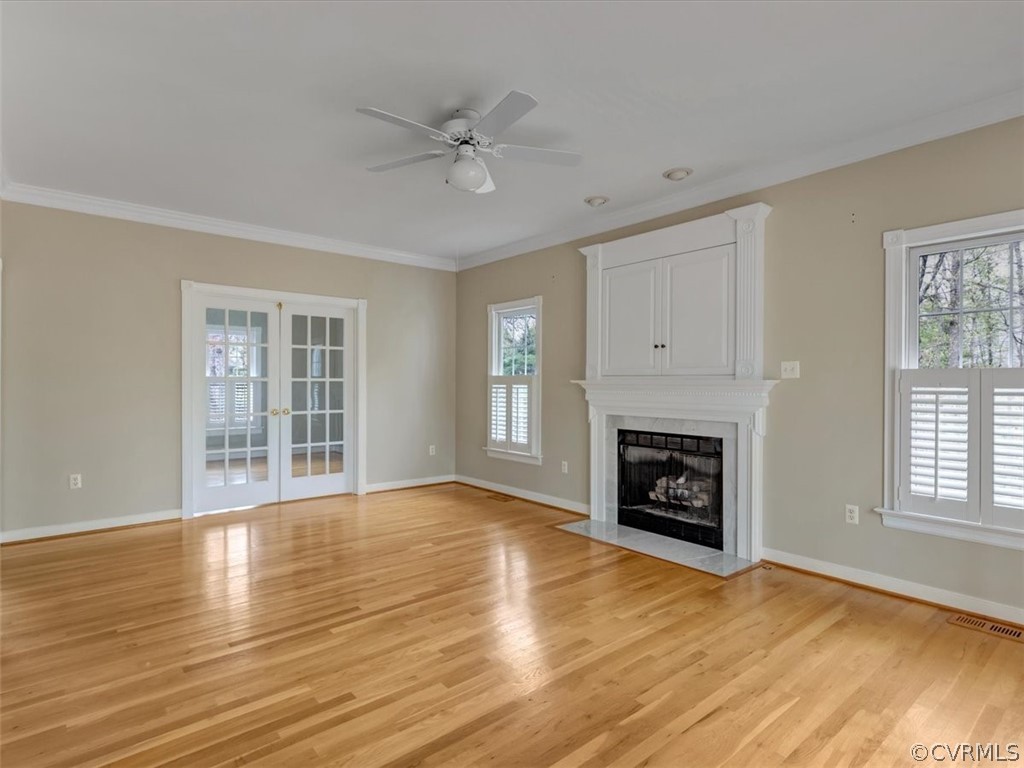 16219 Dragonnade Trail Midlothian, VA 23113 - Photo 12 of 39 a view of an empty room with wooden floor fireplace and a window