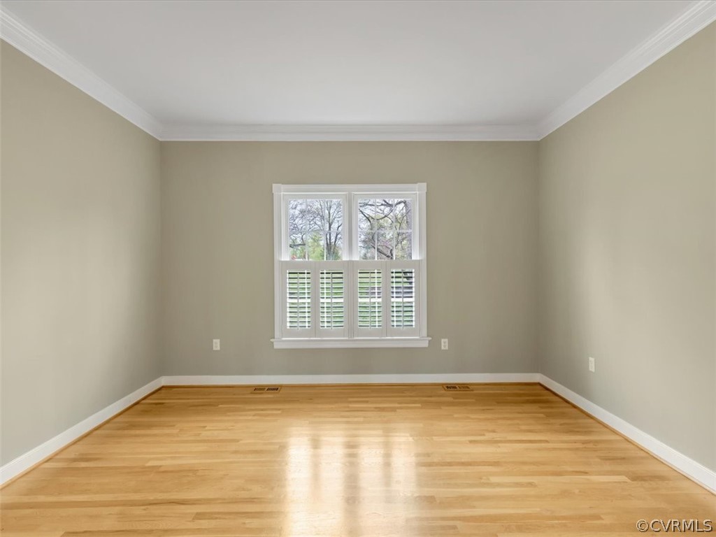 16219 Dragonnade Trail Midlothian, VA 23113 - Photo 13 of 39 a view of an empty room with wooden floor and a window