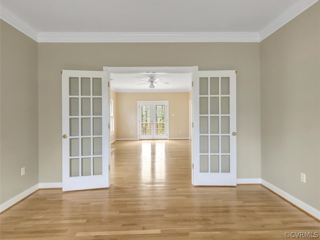 16219 Dragonnade Trail Midlothian, VA 23113 - Photo 14 of 39 an empty room with wooden floor and windows
