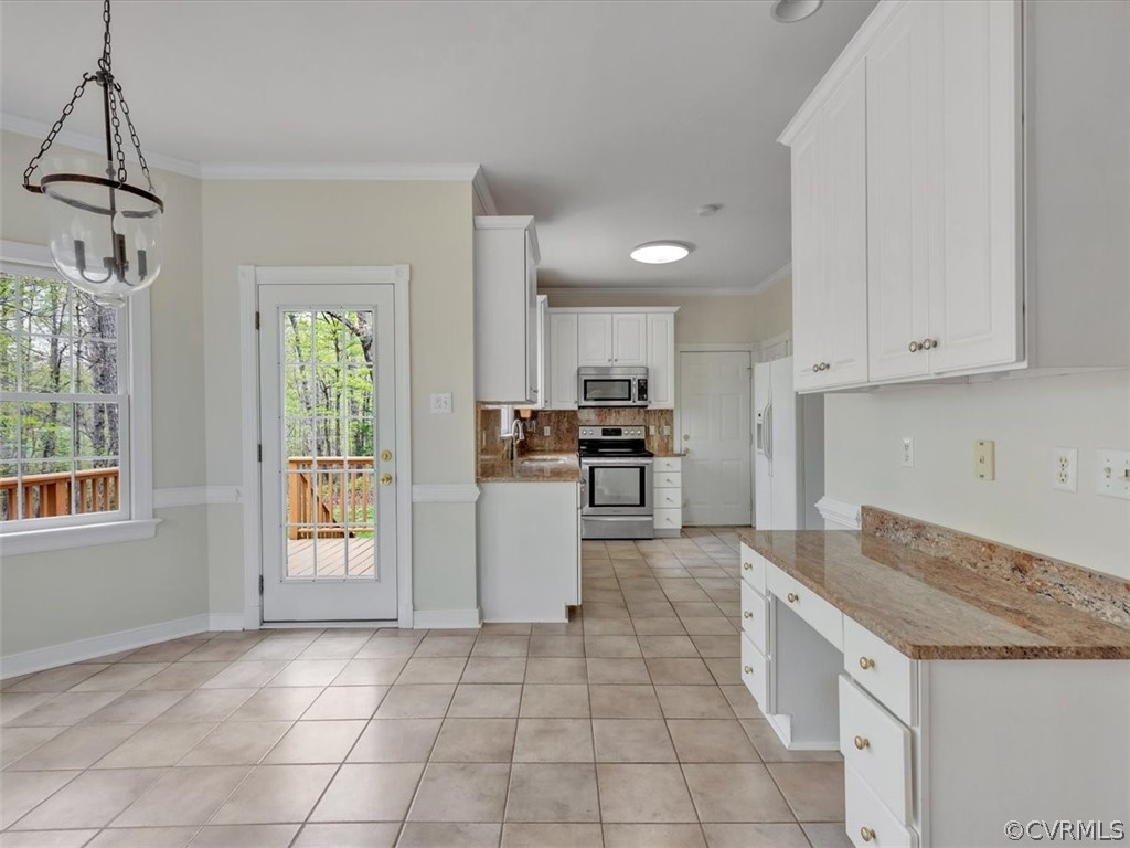 16219 Dragonnade Trail Midlothian, VA 23113 - Photo 16 of 39 a kitchen with granite countertop a stove a sink and a refrigerator