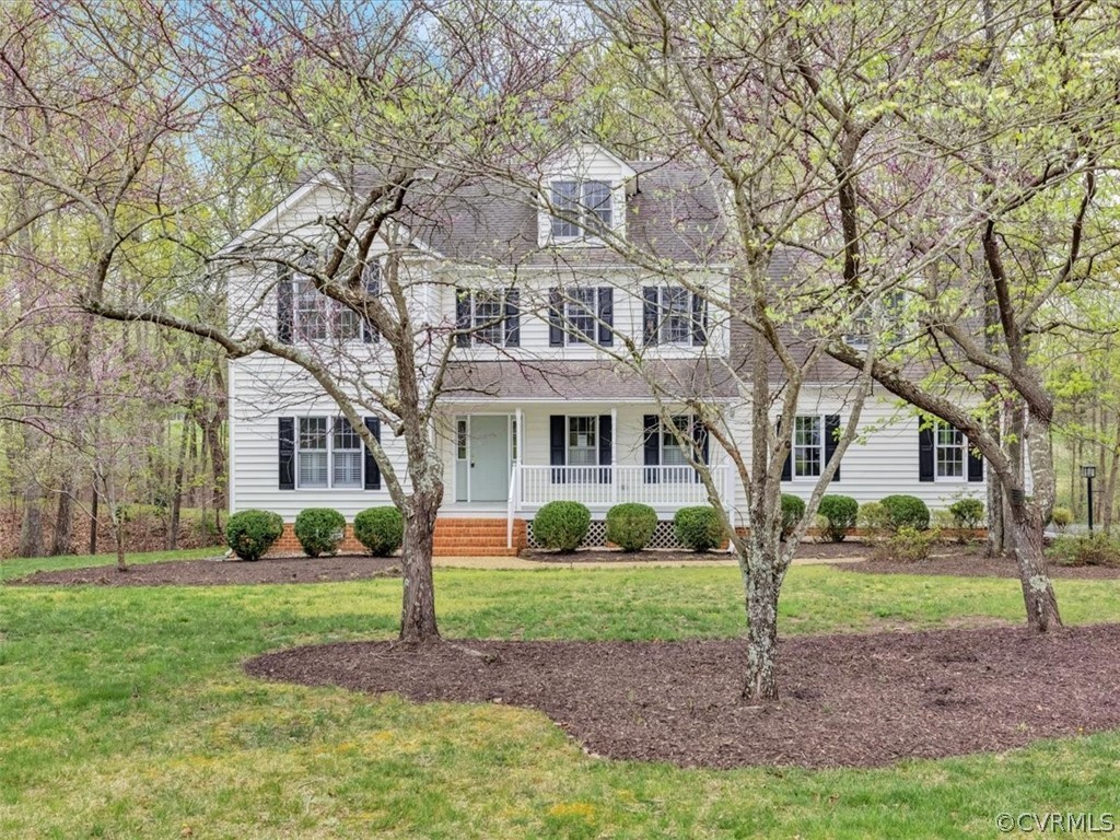 16219 Dragonnade Trail Midlothian, VA 23113 - Photo 2 of 39 a front view of a house with garden