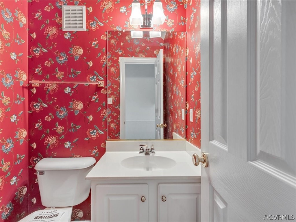 16219 Dragonnade Trail Midlothian, VA 23113 - Photo 22 of 39 a bathroom with a toilet sink and mirror
