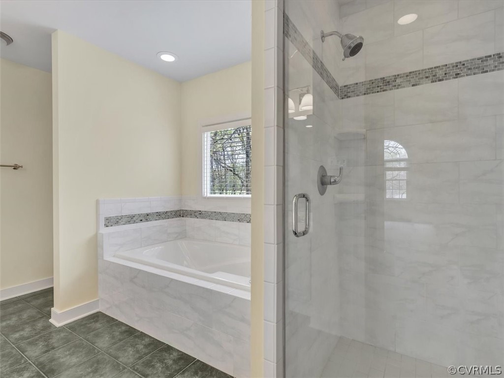 16219 Dragonnade Trail Midlothian, VA 23113 - Photo 25 of 39 a bathroom with a shower and a bath tub