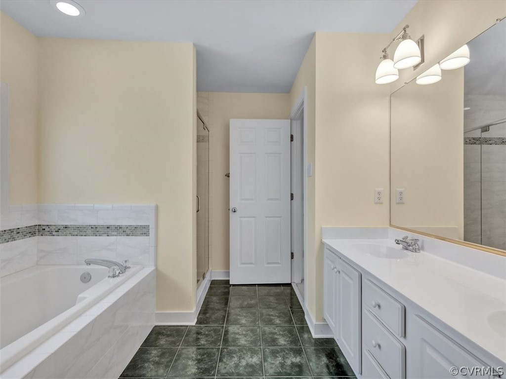 16219 Dragonnade Trail Midlothian, VA 23113 - Photo 26 of 39 a bathroom with a tub sink and a mirror