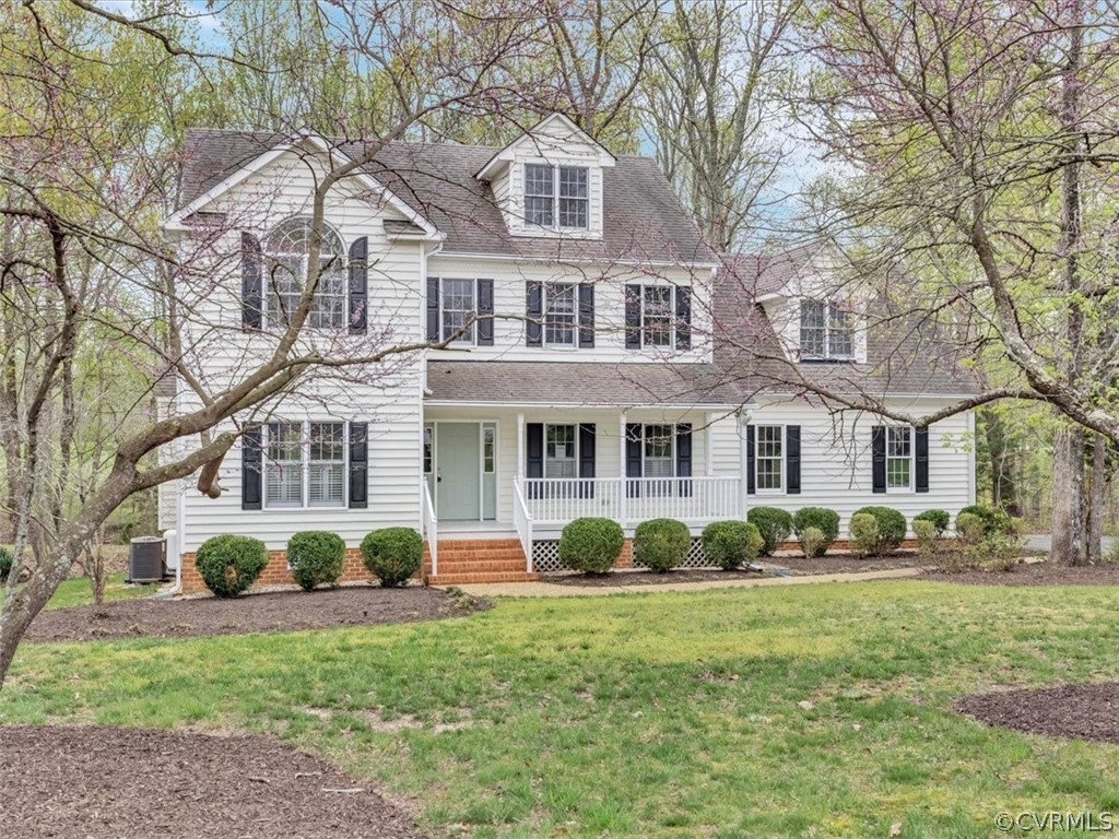 16219 Dragonnade Trail Midlothian, VA 23113 - Photo 3 of 39 a front view of a house with a garden