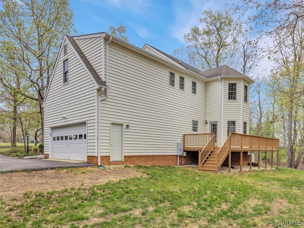 16219 Dragonnade Trail Midlothian, VA 23113 - Photo 38 of 39 a view of a white house with a yard and large trees