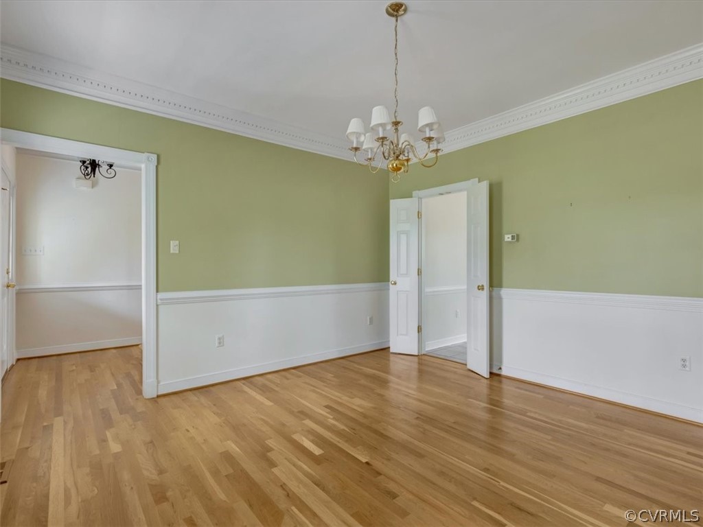 16219 Dragonnade Trail Midlothian, VA 23113 - Photo 9 of 39 a view of an empty room with wooden floor