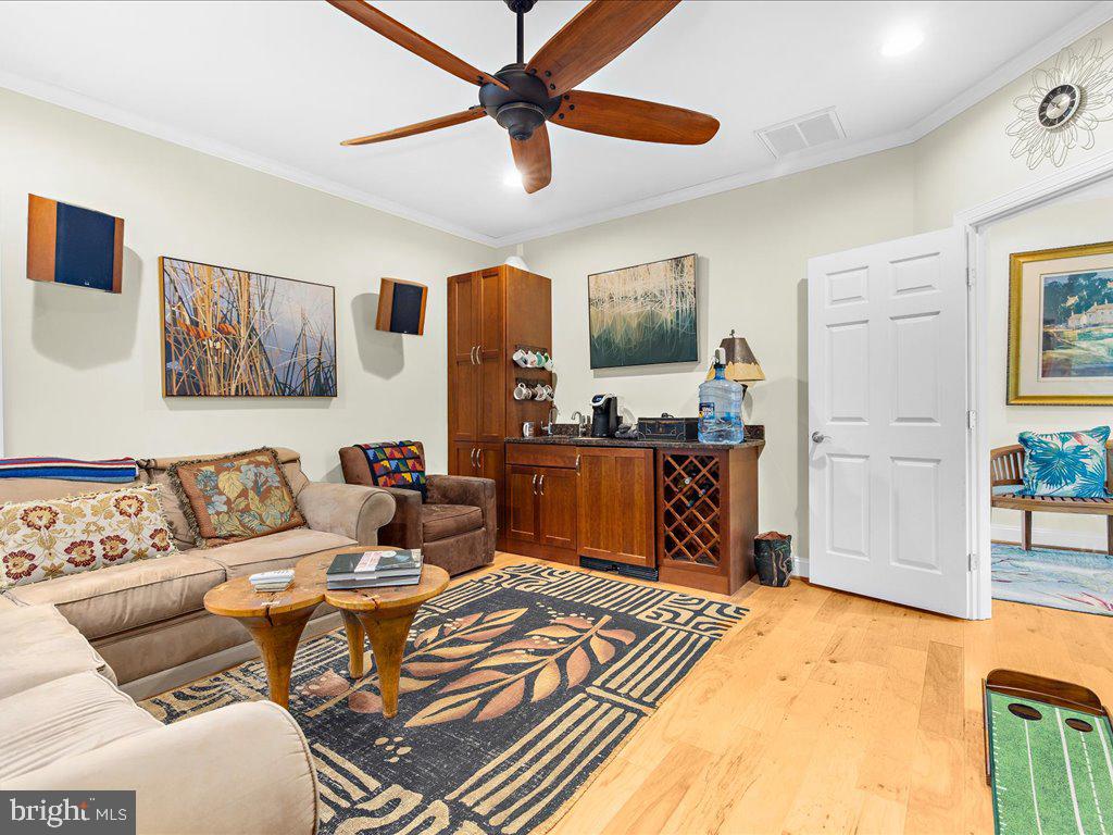 720 Southeast Creek Road Church Hill, MD 21623 - Photo 19 of 53 a living room with furniture and a flat screen tv