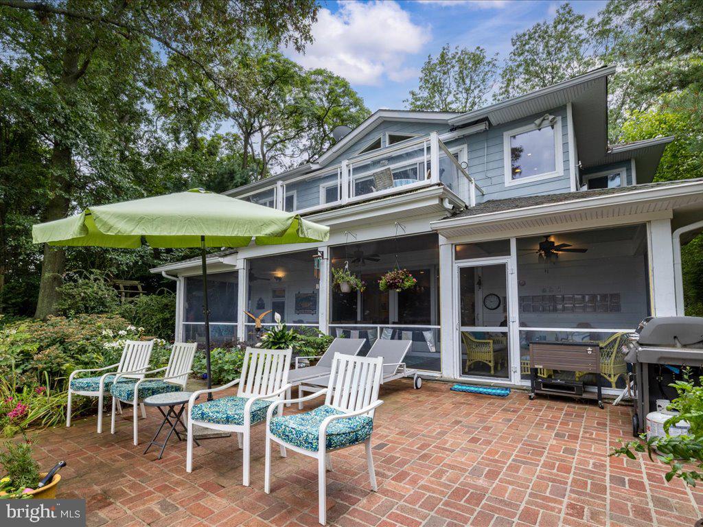 720 Southeast Creek Road Church Hill, MD 21623 - Photo 2 of 53 a view of a chair and table in backyard of the house
