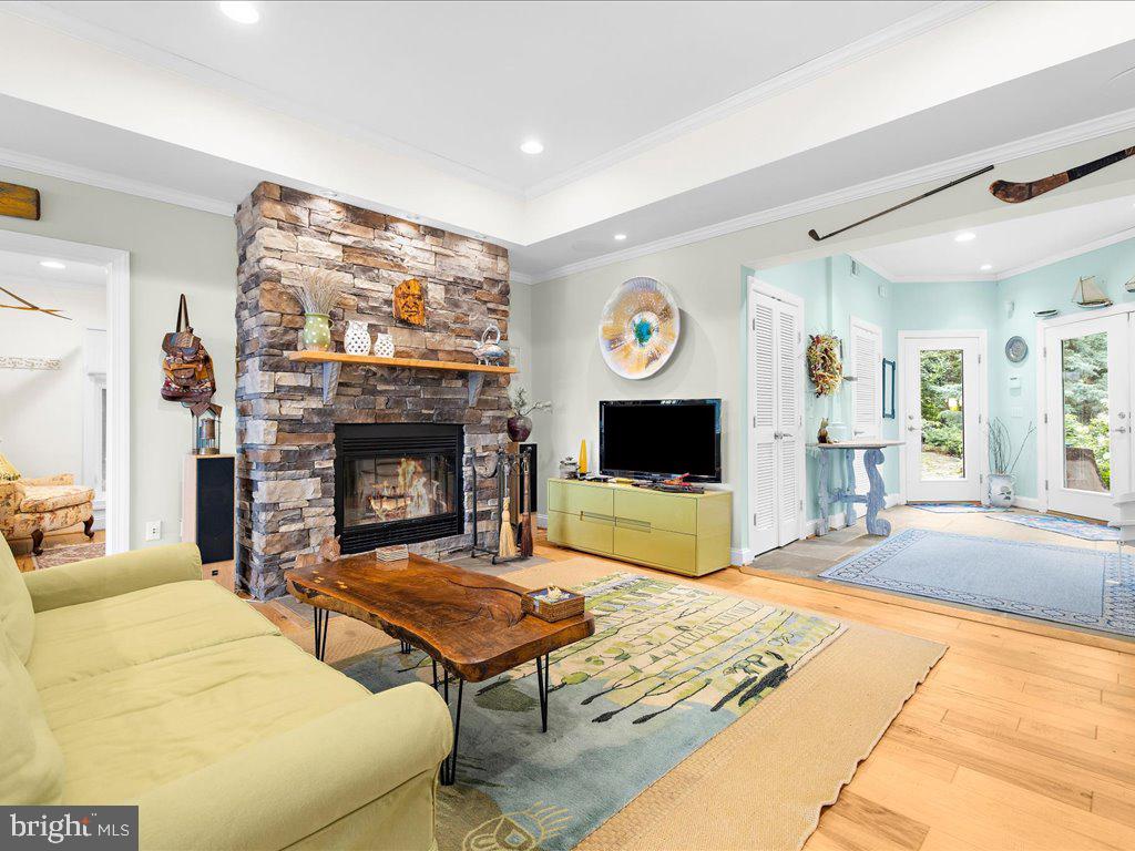 720 Southeast Creek Road Church Hill, MD 21623 - Photo 21 of 53 a living room with furniture a flat screen tv and a fireplace