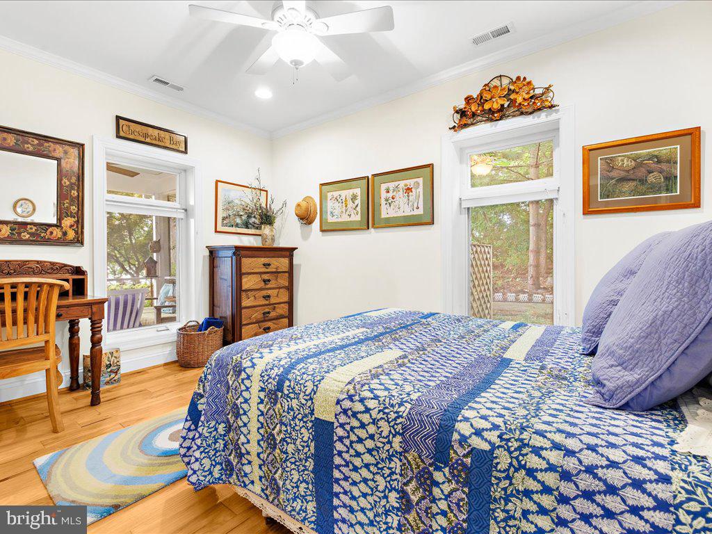 720 Southeast Creek Road Church Hill, MD 21623 - Photo 28 of 53 a bedroom with a bed and wooden floor