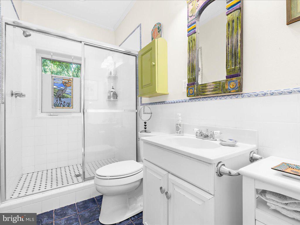 720 Southeast Creek Road Church Hill, MD 21623 - Photo 29 of 53 a bathroom with a sink a toilet and shower