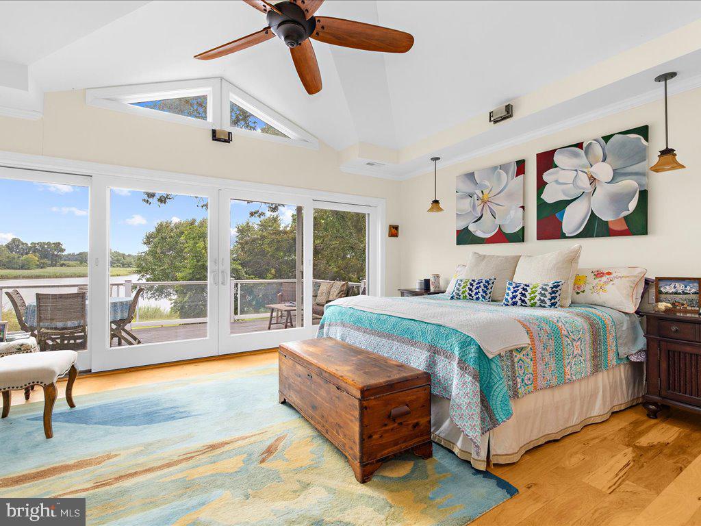 720 Southeast Creek Road Church Hill, MD 21623 - Photo 3 of 53 a spacious bedroom with a bed couch and a large window