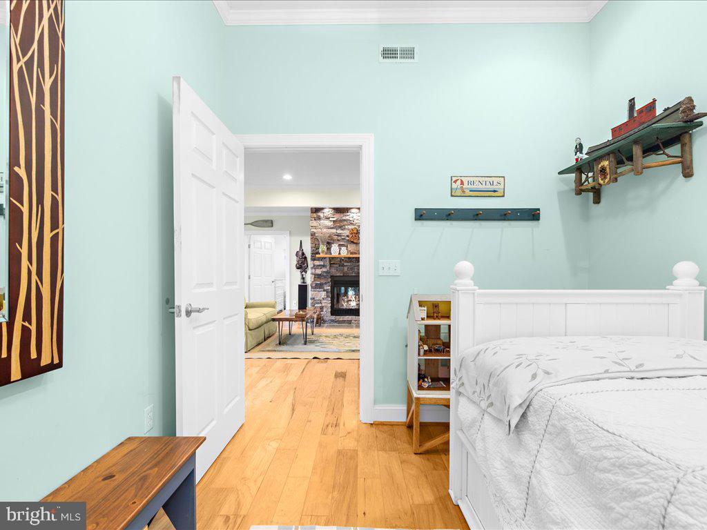 720 Southeast Creek Road Church Hill, MD 21623 - Photo 30 of 53 a bed room with a bed and a book shelf