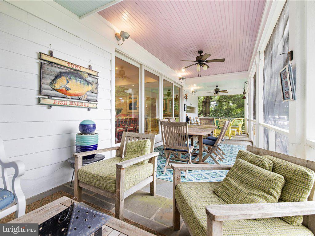 720 Southeast Creek Road Church Hill, MD 21623 - Photo 31 of 53 a living room with furniture and a large window