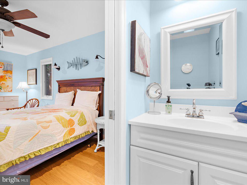 720 Southeast Creek Road Church Hill, MD 21623 - Photo 36 of 53 a bedroom with a bed and a mirror