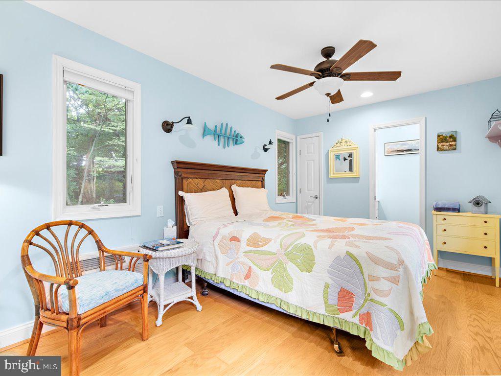 720 Southeast Creek Road Church Hill, MD 21623 - Photo 37 of 53 a bedroom with a bed and wooden floor