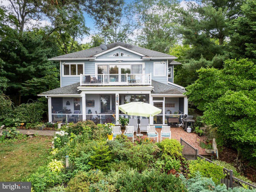720 Southeast Creek Road Church Hill, MD 21623 - Photo 39 of 53 a front view of a house with a yard table and chairs