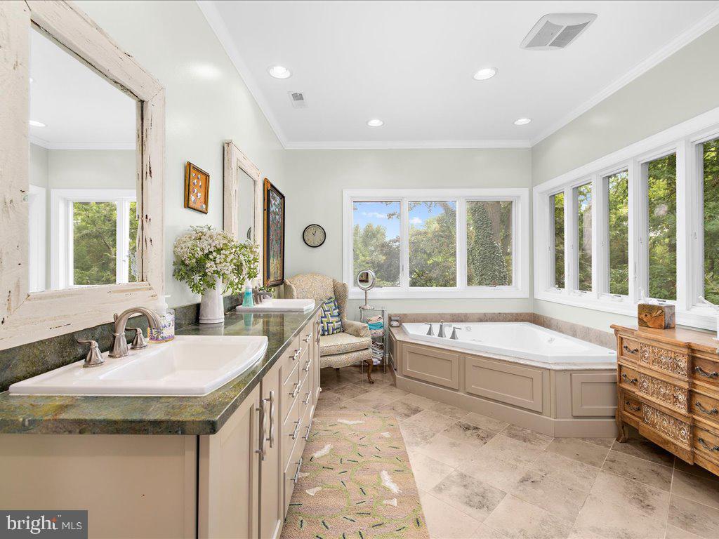 720 Southeast Creek Road Church Hill, MD 21623 - Photo 4 of 53 a bathroom with a granite countertop tub sink and mirror